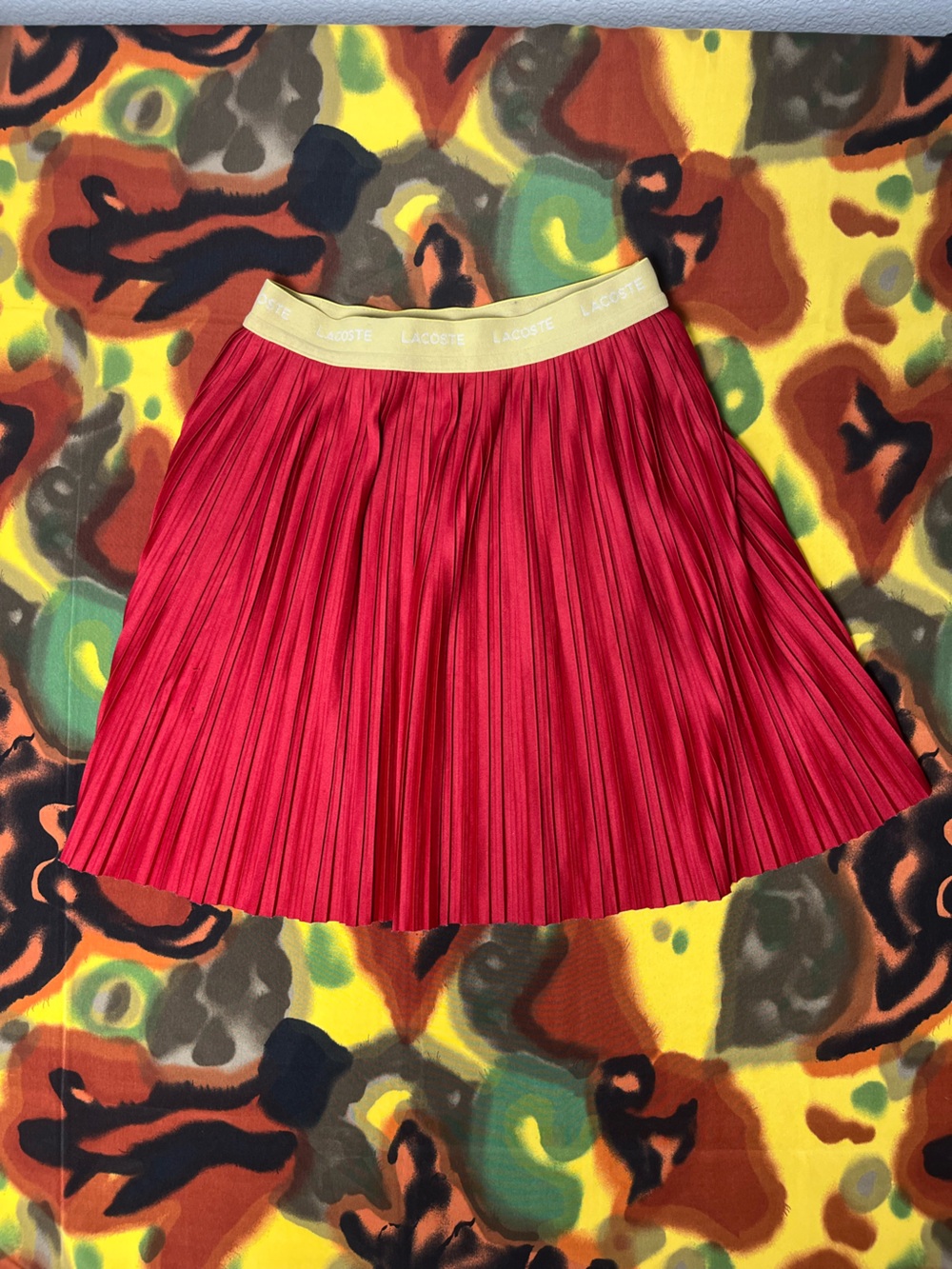 Lacoste red pleated skirt with beige waistband, size 10 women’s